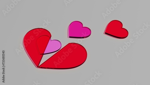 Cztery szklane czerwone różowe purpurowe serca na szarym tle wychodzące z dużego czerwonego serca