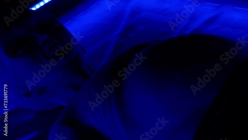 Area 51. A life-size humanoid after a UFO crash. An alien in ultraviolet light. Whole-body view