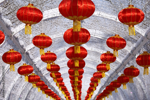 Red Chinese lanterns in a row on a street. New Year celebration in Asia