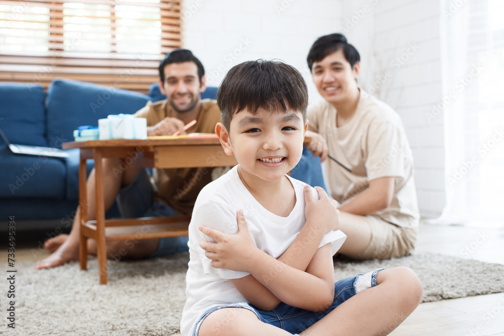 LGBTQ couple and their adopted child. LGBTQ couple and their adopted child.