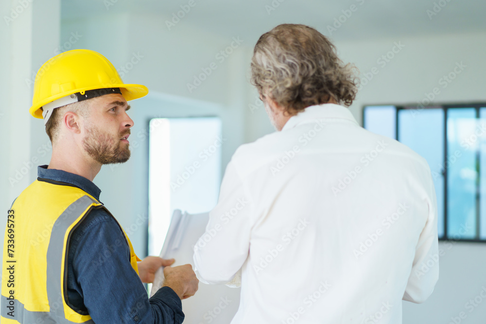 Construction contractor talking with client. Construction contractor talking with client.