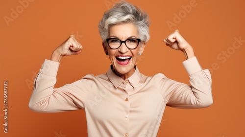 hooray elder woman indicate empty space wear spectacles shirt isolated on color background, joyful, cheerful, adult, achievement, retirement, happy, happiness, success