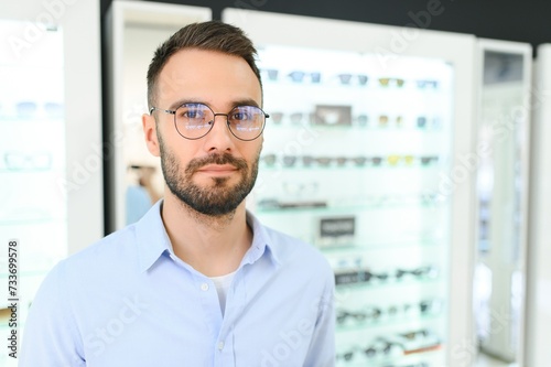 man chooses glasses for vision correction in an ophthalmology salon. Glasses for vision correction