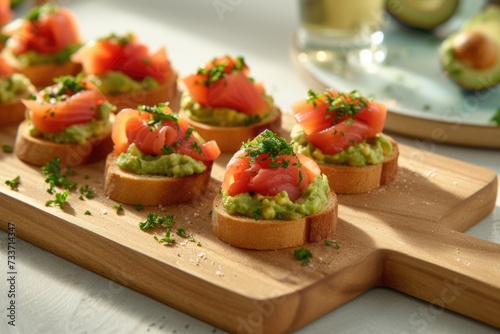 Open sandwiches toasts with salted salmon, avocado guacamole, roasted chickpeas