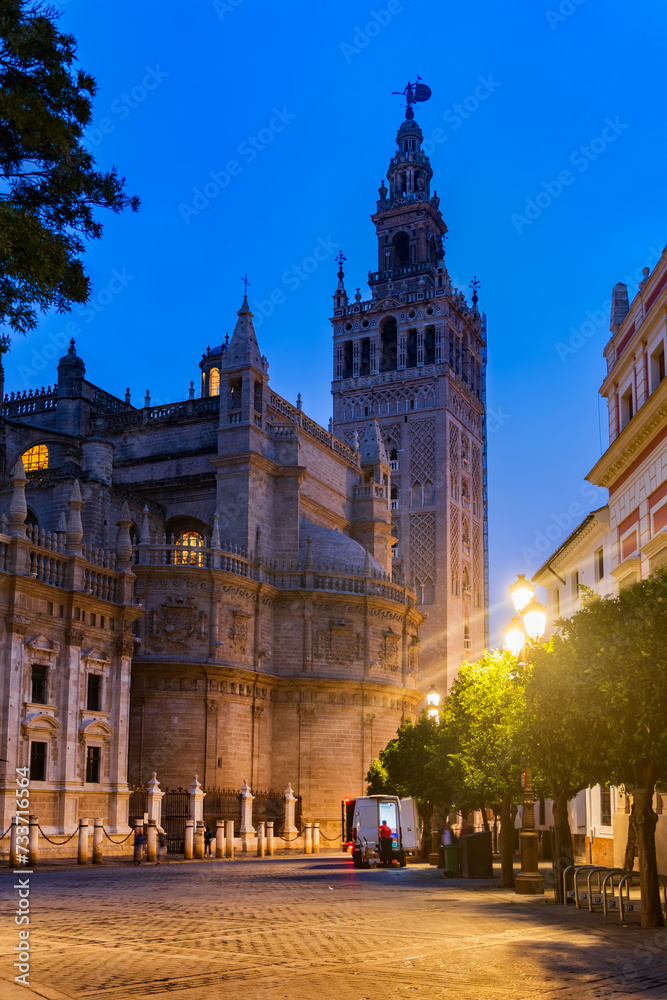 Seville Cathedral And Giralda Tower At Night In Spain