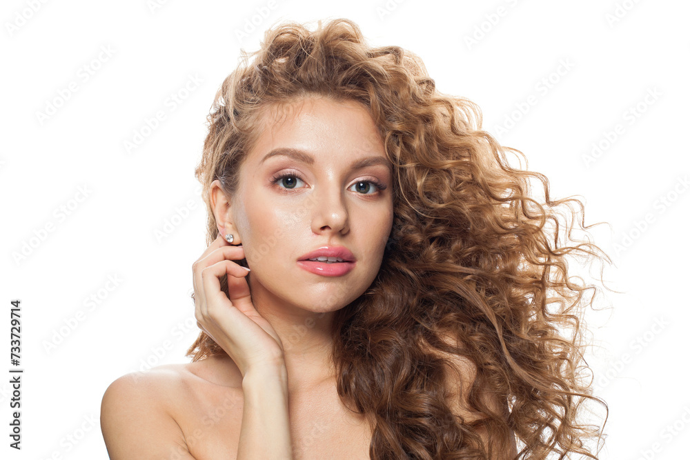 Charming healthy model with natural make-up, shiny clear skin and long curly hairstyle showing her ear with diamond jewelry earring isolated on white background