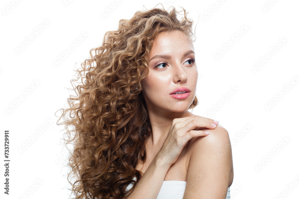Elegant healthy model with natural make-up, shiny clear skin and long curly hairstyle. Haircare, Skincare, Cosmetology and Styling concept Elegant healthy model with natural make-up, shiny clear skin and long curly hairstyle. Haircare, Skincare, Cosmetology and Styling concept