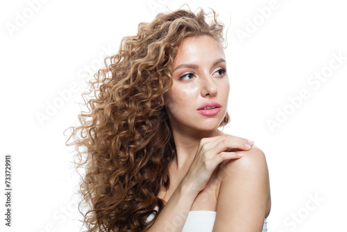 Elegant healthy model with natural make-up, shiny clear skin and long curly hairstyle. Haircare, Skincare, Cosmetology and Styling concept