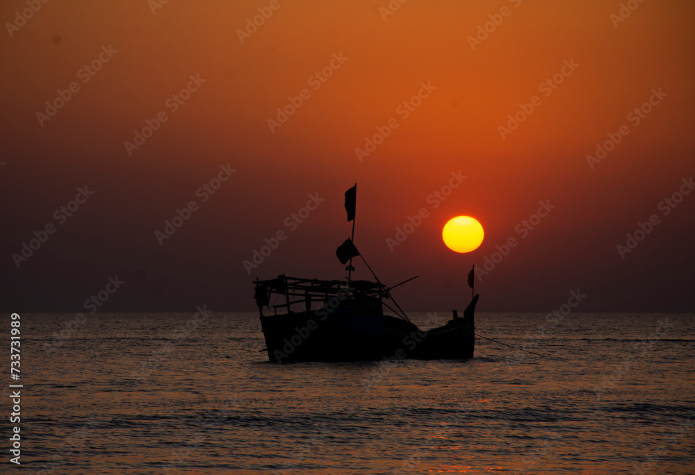 fishing boat in the sunset. Last light on sea there have a boat and the sun.