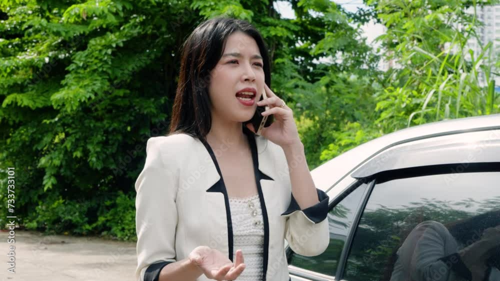 Beautiful Asian woman was driving had accident in middle road, Opening car door, standing near car anxiously, holding phone call with car insurance company came scene, talking with bad expression. Beautiful Asian woman was driving had accident in middle road, Opening car door, standing near car anxiously, holding phone call with car insurance company came scene, talking with bad expression.