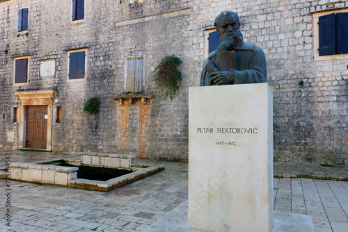 Sculpture of Croatian Renaissance poet Petar Hektorovic in Stari Grad, Hvar island, Croatia. photo