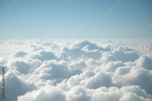 Scenery seen from airplane above the white clouds in the sky