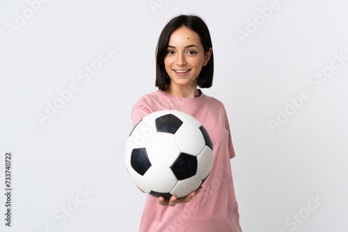 Young caucasian woman isolated on white background with soccer ball © luismolinero