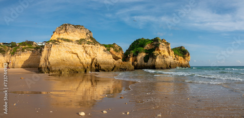 Spectacular sea stacks and rock formations in the Praia dos Três Irmãos (three brothers) beach, Alvor, Algarve, Portugal