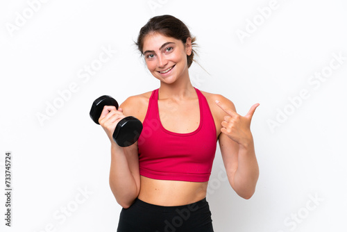Young sport caucasian woman making weightlifting isolated on white background giving a thumbs up gesture