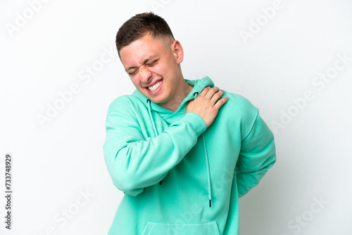 Young brazilian man isolated on white background suffering from pain in shoulder for having made an effort © luismolinero