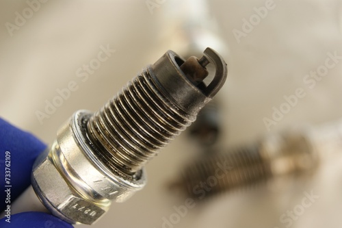 Used gasoline engine spark plugs close-up. High quality photo