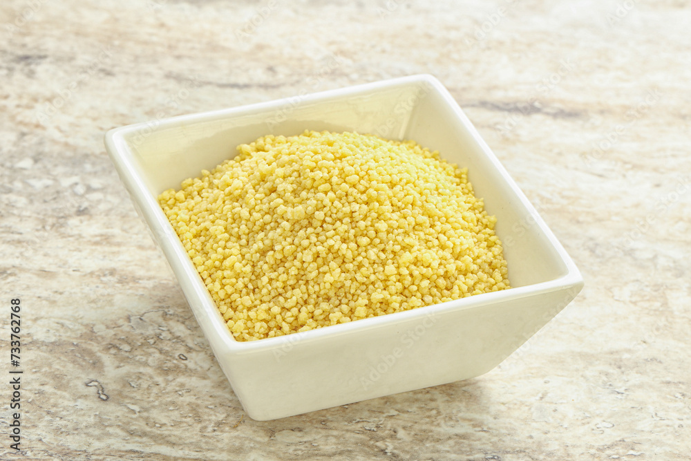 Raw couscous in the bowl