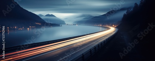 blurred traffic background banner at night with mountain view © krissikunterbunt