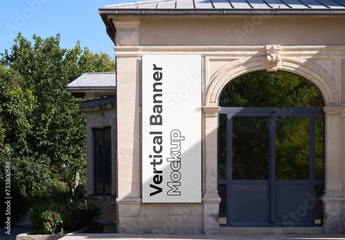 Mockup of customizable vertical banner on building