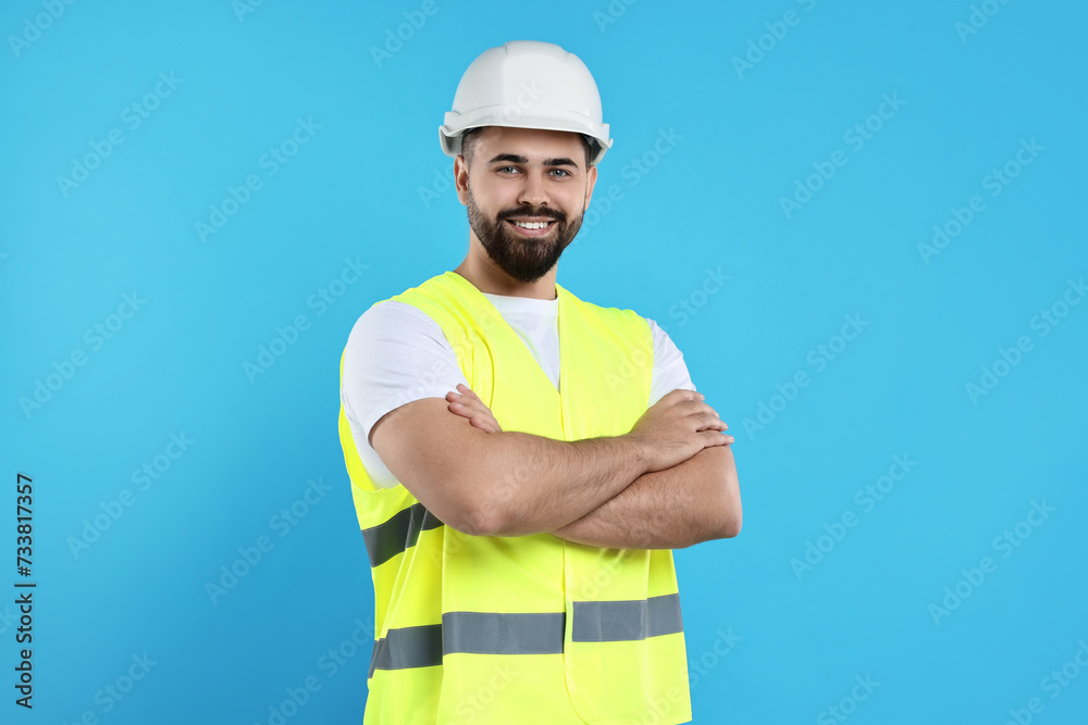 Engineer in hard hat on light blue background Engineer in hard hat on light blue background