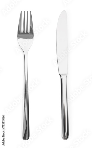 Silver fork and knife isolated on white, top view