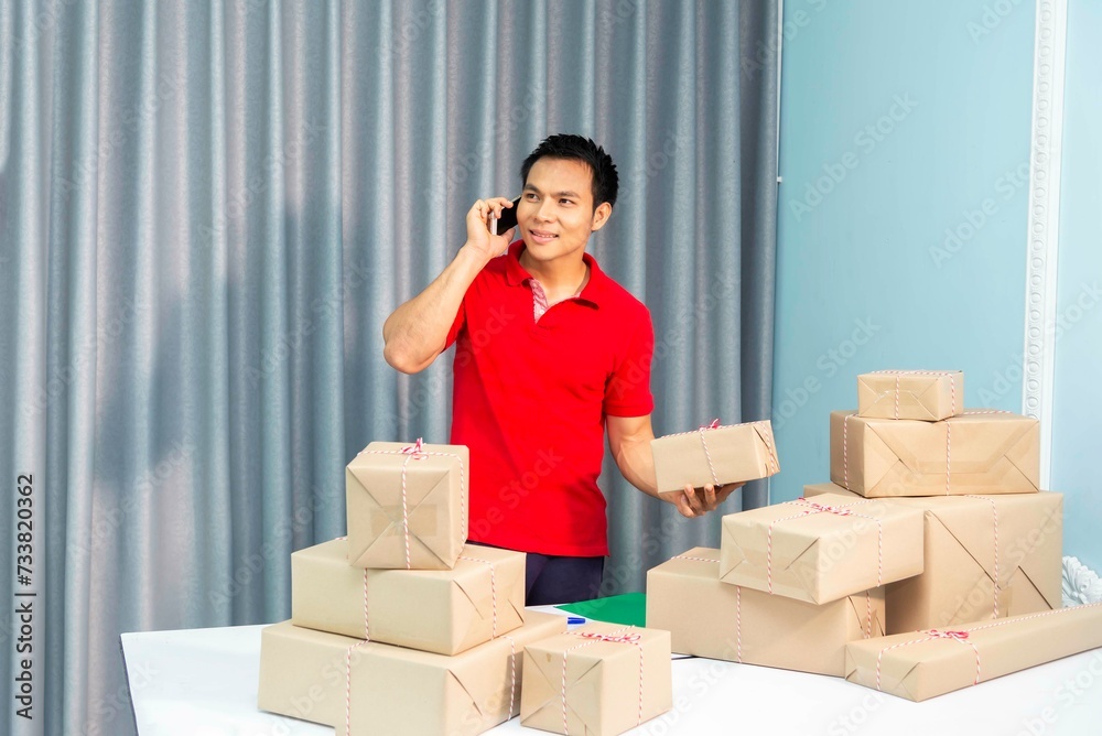 Smile for sales success after checking order from online shopping store in a smartphone at home office, sell to customers, sme business ideas online. Smile for sales success after checking order from online shopping store in a smartphone at home office, sell to customers, sme business ideas online.