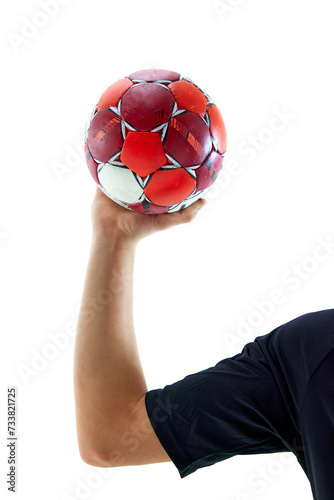 Male hand holding handball ball against white studio background. Attributes of game. Concept of professional sport, tournament, competition. Poster for ad. Promotional material for sport event