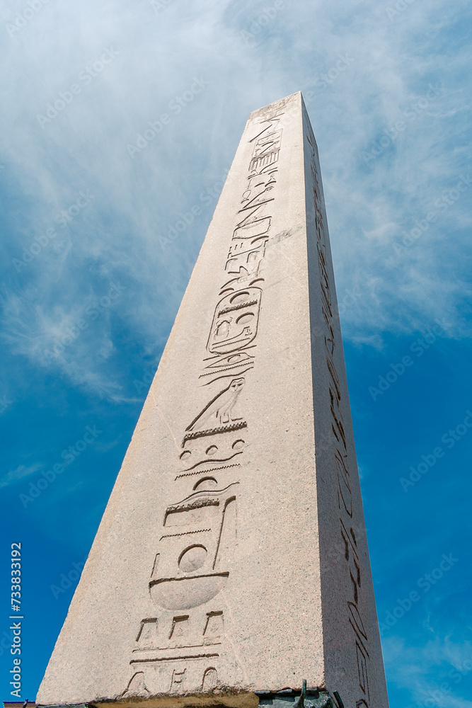 Obelisk of Theodosius in Istanbul. Ancient Egyptian obelisk against a blue sky.