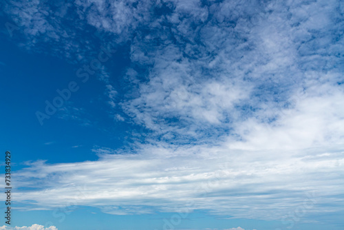 a visible mass of condensed water vapor floating in the atmosphere, typically high above the ground.