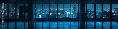 empty night time office space with lit city panorama visible in the background (6)