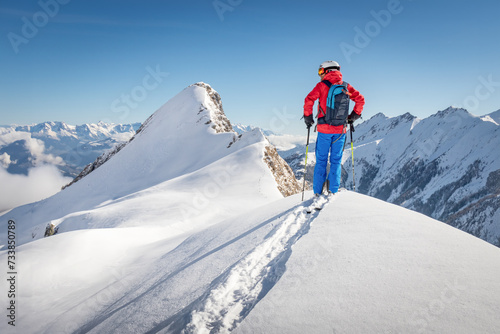Male freeride skier in the alps
