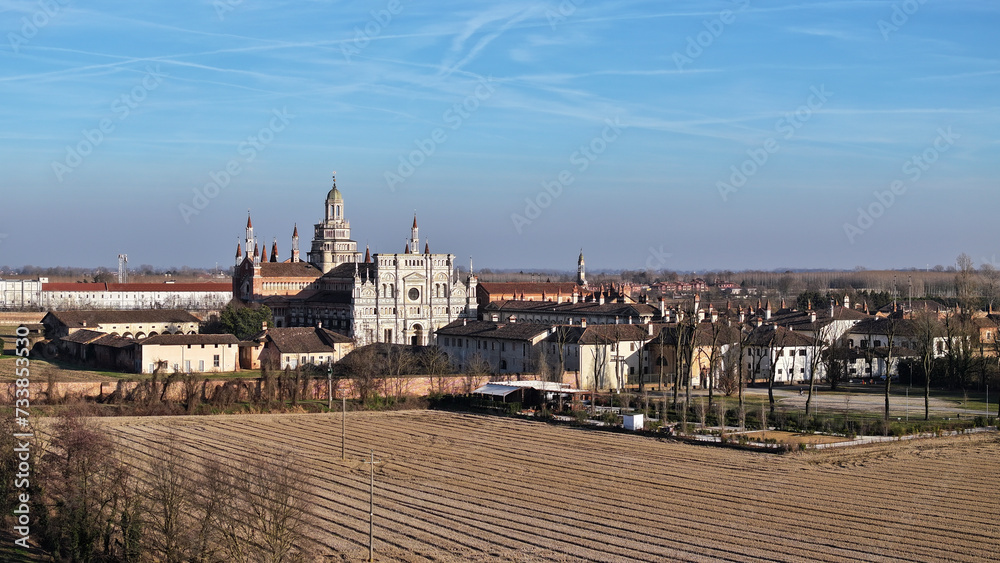 Aerial shot of Certosa di Pavia cathedral a historical monumental complex that includes a monastery and a sanctuary. Pavia ,Italy. Aerial shot of Certosa di Pavia cathedral a historical monumental complex that includes a monastery and a sanctuary. Pavia ,Italy.