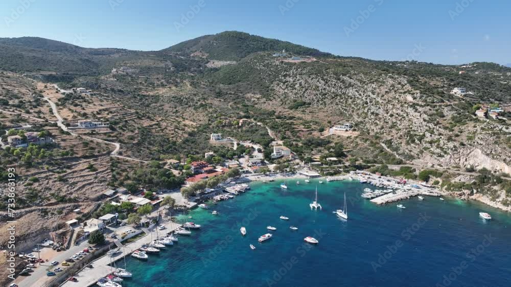 Aerial drone photo of Agios Nikolaos - a small port on the island of Zante. Port on a Greek island with blue turquoise water with many boats and yachts on the water in Greece, Zakynthos. Aerial drone photo of Agios Nikolaos - a small port on the island of Zante. Port on a Greek island with blue turquoise water with many boats and yachts on the water in Greece, Zakynthos.