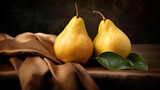 Fresh ripe organic yellow pears with water drops on rustic wooden board
