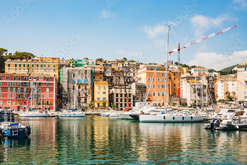 Corsica, Bastia panoramic view of Porto Vecchio old town and harbor, Corsica island, France. Old port with colorful facade and sailing boats, popular touristic travel destination. photo