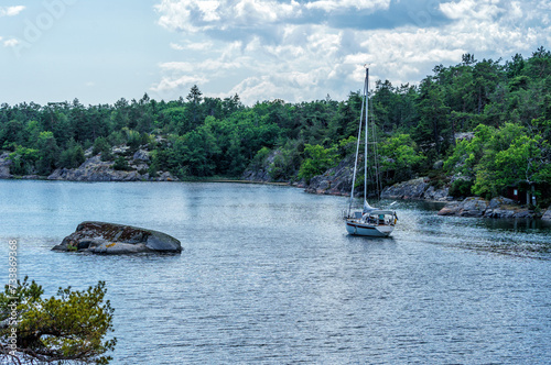 A sailboat in St. Anna's archipelago on an almost windless summer day