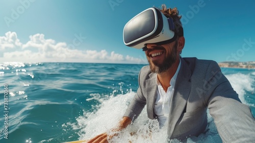 A bearded man in a suit with a vr headset experiences surfing on waves, depicting a blend of business and leisure © Glittering Humanity