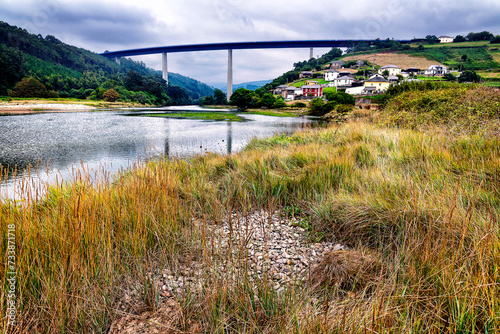 Rio Canero, viaducto y el pueblo de Cueva photo