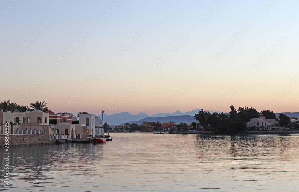 Fototapeta premium twilight at a quite marina with mountain silhouette at El Gouna, Egypt