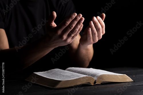 Photography Man with bible praying. Concept religion and faith.