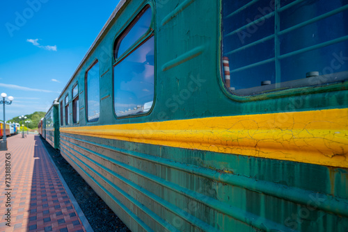 An old passenger car at the railway station in close-up.