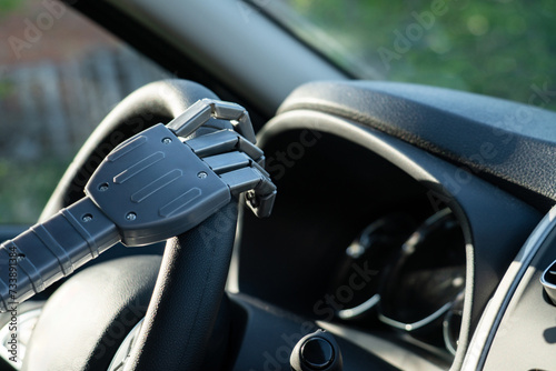 Robot arm on a steering wheel. Artificial intelligence drives a car. Autonomous vehicle concept