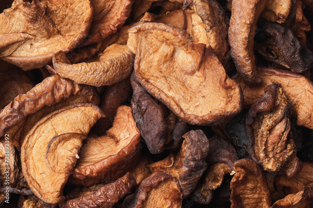 Dried apples texture. Dry fruits background. Healthy snack. Closeup macro food. Chewy apple piece. Dried apples texture. Dry fruits background. Healthy snack. Closeup macro food. Chewy apple piece.