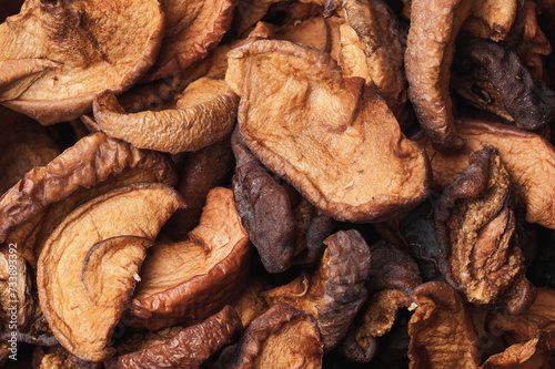 Dried apples texture. Dry fruits background. Healthy snack. Closeup macro food. Chewy apple piece.