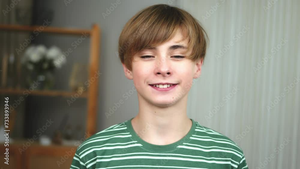 Happy smiling smiley teenage boy looking at camera. Portrait of Teenager boy guy indoors. Toothy child kid boy looking Happy smiling smiley teenage boy looking at camera. Portrait of Teenager boy guy indoors. Toothy child kid boy looking