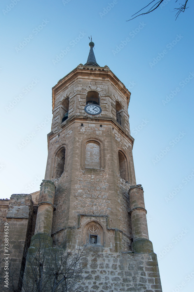 Tower with clock of the church of Our Lady of the Assumption in Tembleque, province of Toledo. Spain