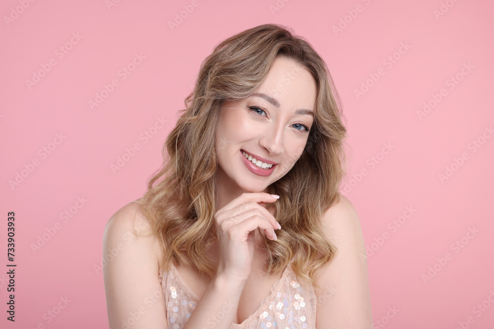 Portrait of smiling woman on pink background Portrait of smiling woman on pink background