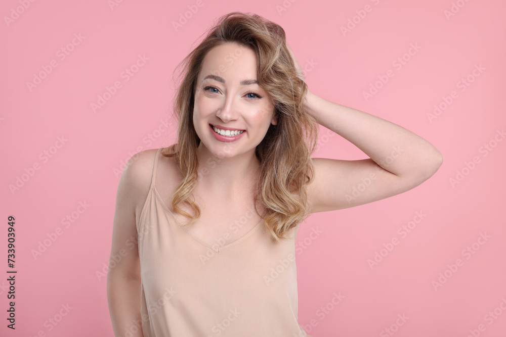 Portrait of smiling woman on pink background Portrait of smiling woman on pink background