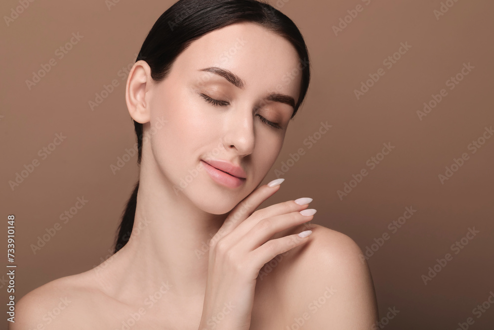 Portrait of beautiful young woman on brown background. Space for text Portrait of beautiful young woman on brown background. Space for text
